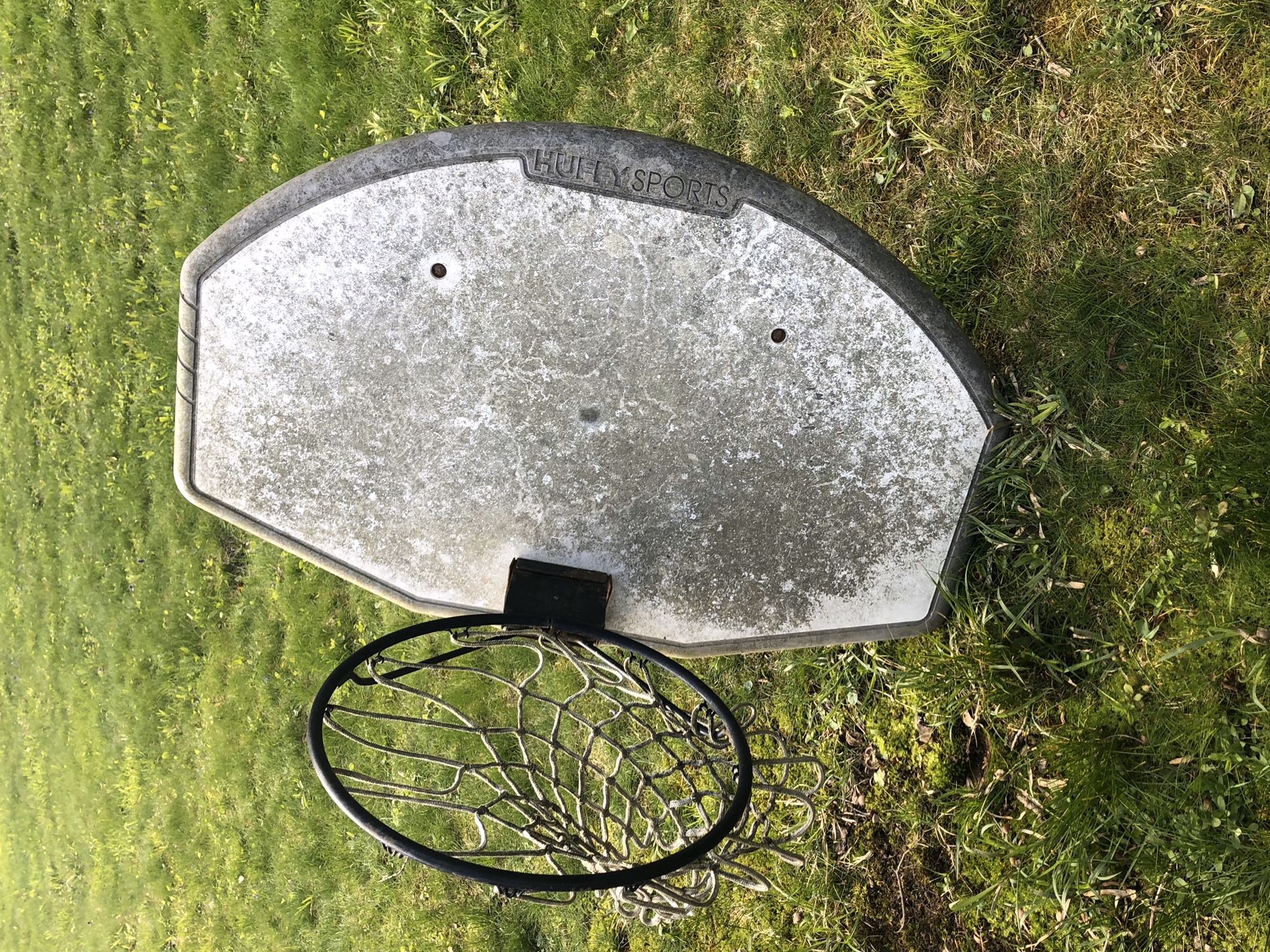 Adjustable basketball hoop and backboard.
