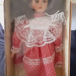 My Treasure, Genuine Porcelain Doll, 13in Tall, Red Dress w/ White Lace Trimming. 
