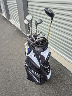 Golf clubs and golf bag with misc. Items