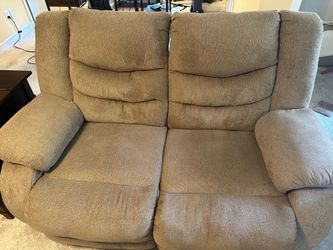 Brown reclining loveseat