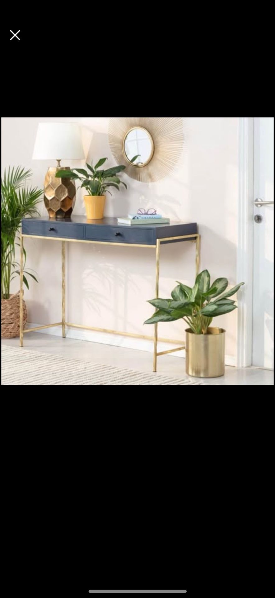 Navy blue gold entryway table.