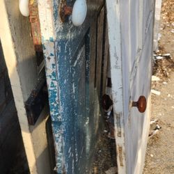 Doors With Ceramic Knobs And Antique Hinges