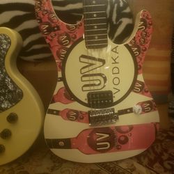 2 guitars, UV vodka guitars,, Both Are In excellent condition,,