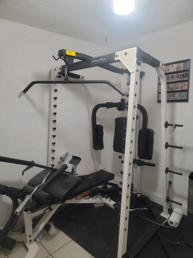 Has Pull Down,and Butterfly Pads Are Taped .and Bench.,curl Bar