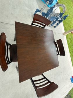 5-piece dining set (table + 4 chairs) in good used condition.