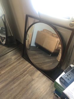 Framed circular mirror