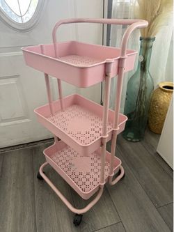 Pink rolling storage cart