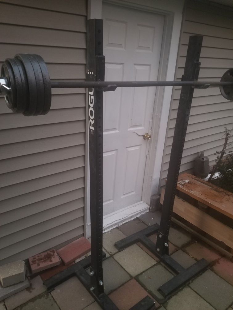Rouge squat/bench stands. Olympic barbell. Weights.