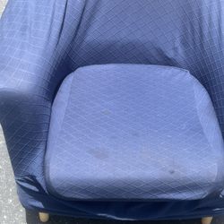 Red accent chair currently has blue removable covers . 