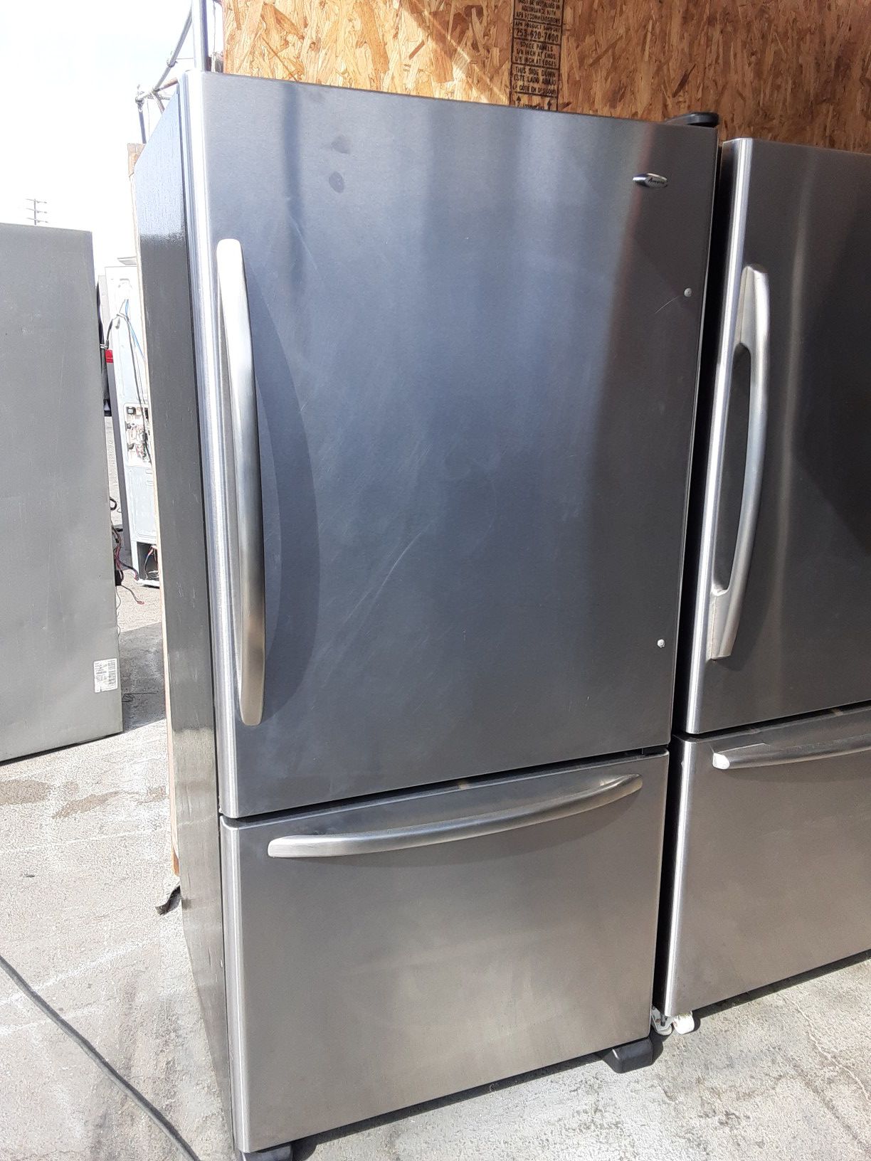 $399 Whirlpool Amana stainless bottom freezer fridge measures 33 wide includes delivery in the San Fernando Valley a warranty and installation