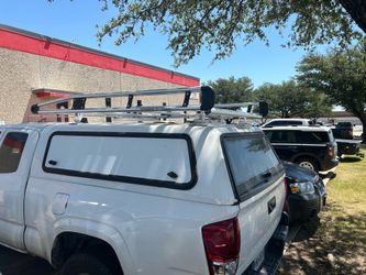 Camper shell with rack