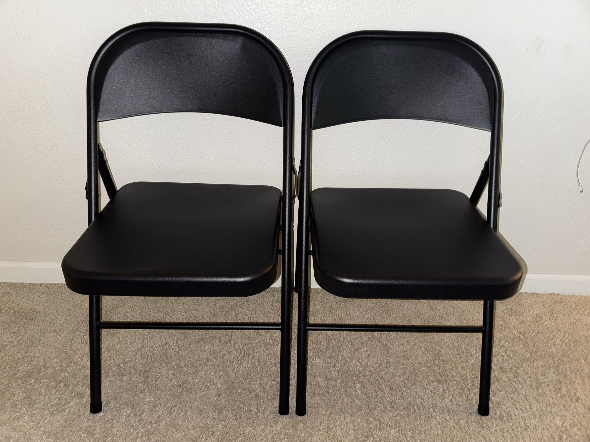 Two Black Metal Folding Chairs