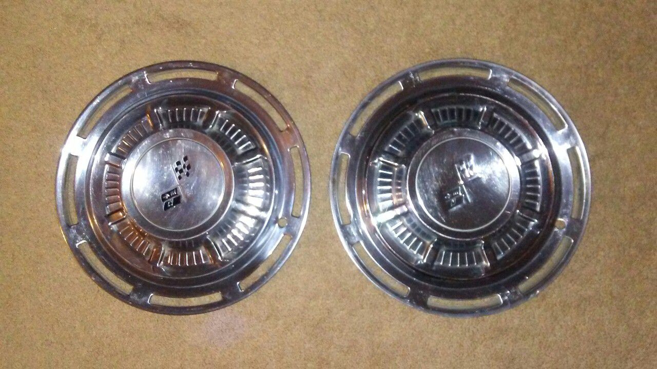 Two 59 Chevy 14" hubcaps