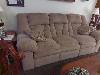 Couch reclines on both ends, no rips. No tears perfect very heavy