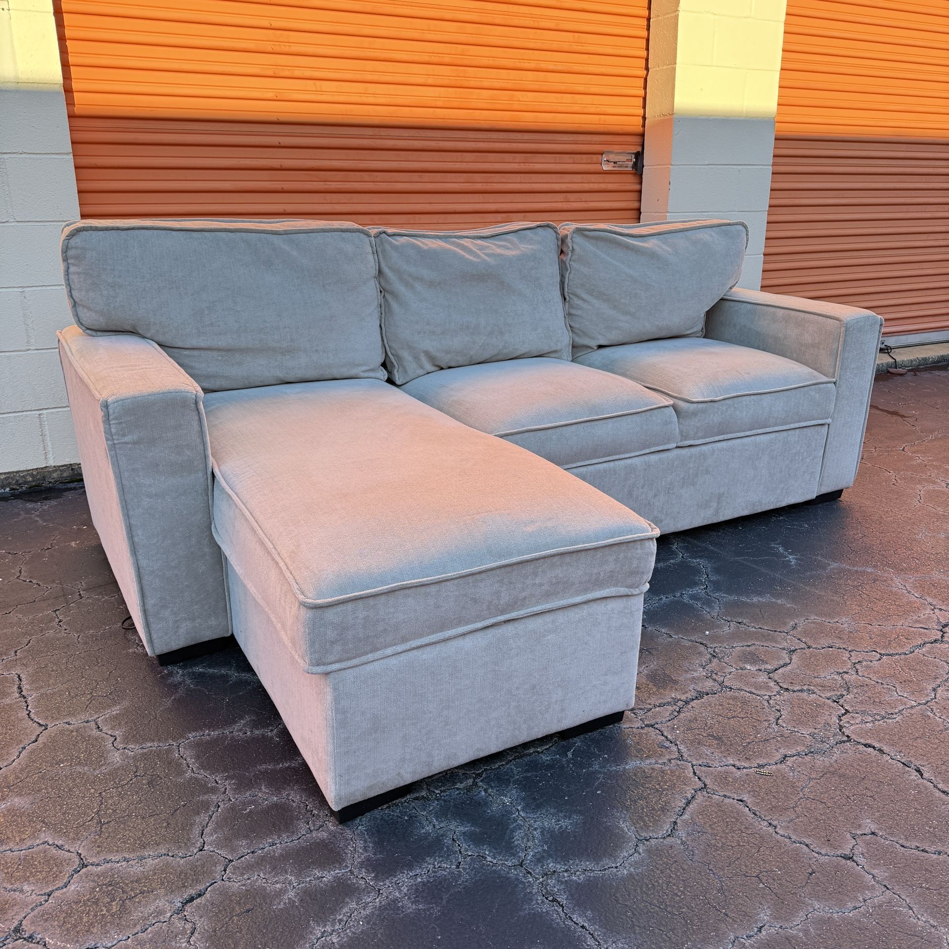 Free Delivery - Cream Sectional Couch with Storage Chaise and Rollout Bed