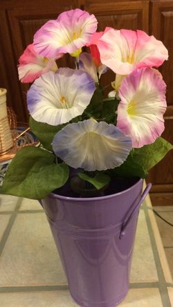 A bucket of petunias. 17" Tall. No they're not real.