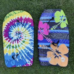 Two boogie boards with tether straps