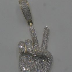 10kt yellow gold hand pendant 5.7 grams with 1.25-1.5 carats pre owned. mint condition. 866993-1. 