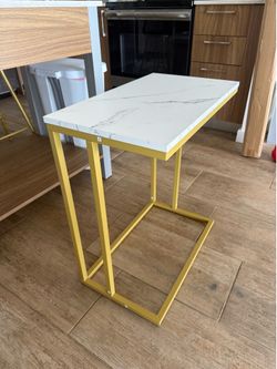 White and Gold C shaped table