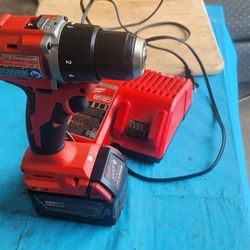 Milwaukee Drill, battery, and Changer