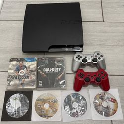Playstation 3 with 2 controllers and 6 games
