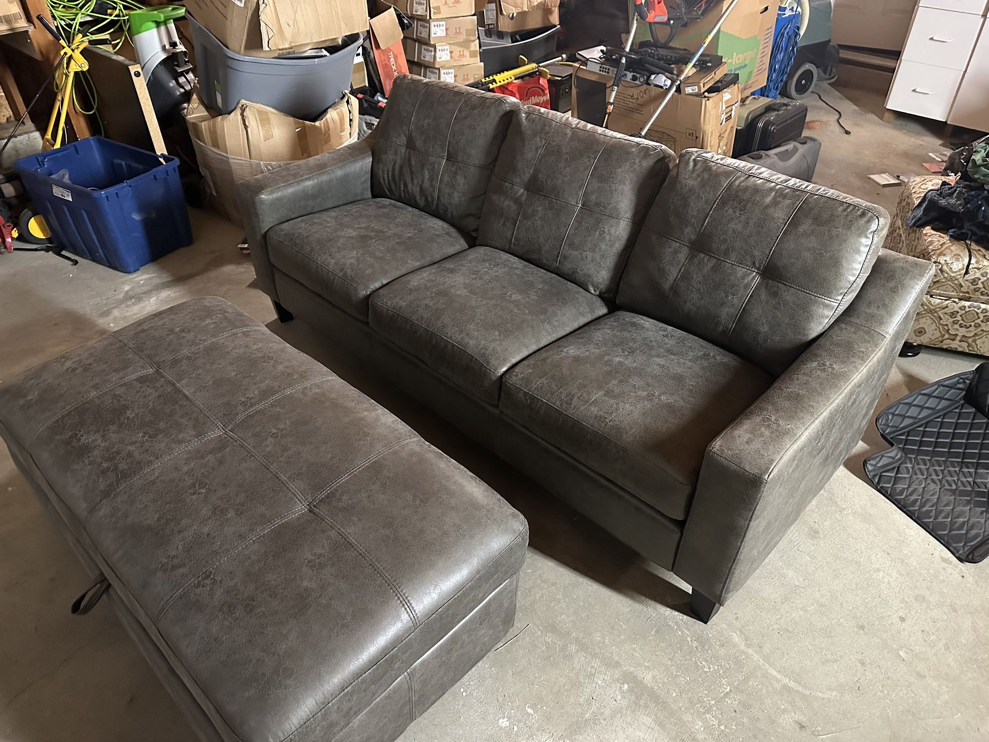 grey brand new small couch and ottoman in great condition