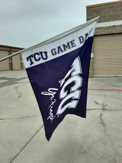 Tcu game day flag on a pole.
