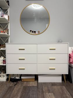White dresser with gold accents