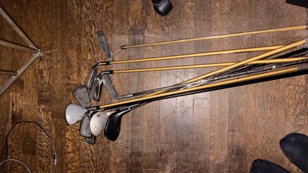 Assorted vintage golf clubs