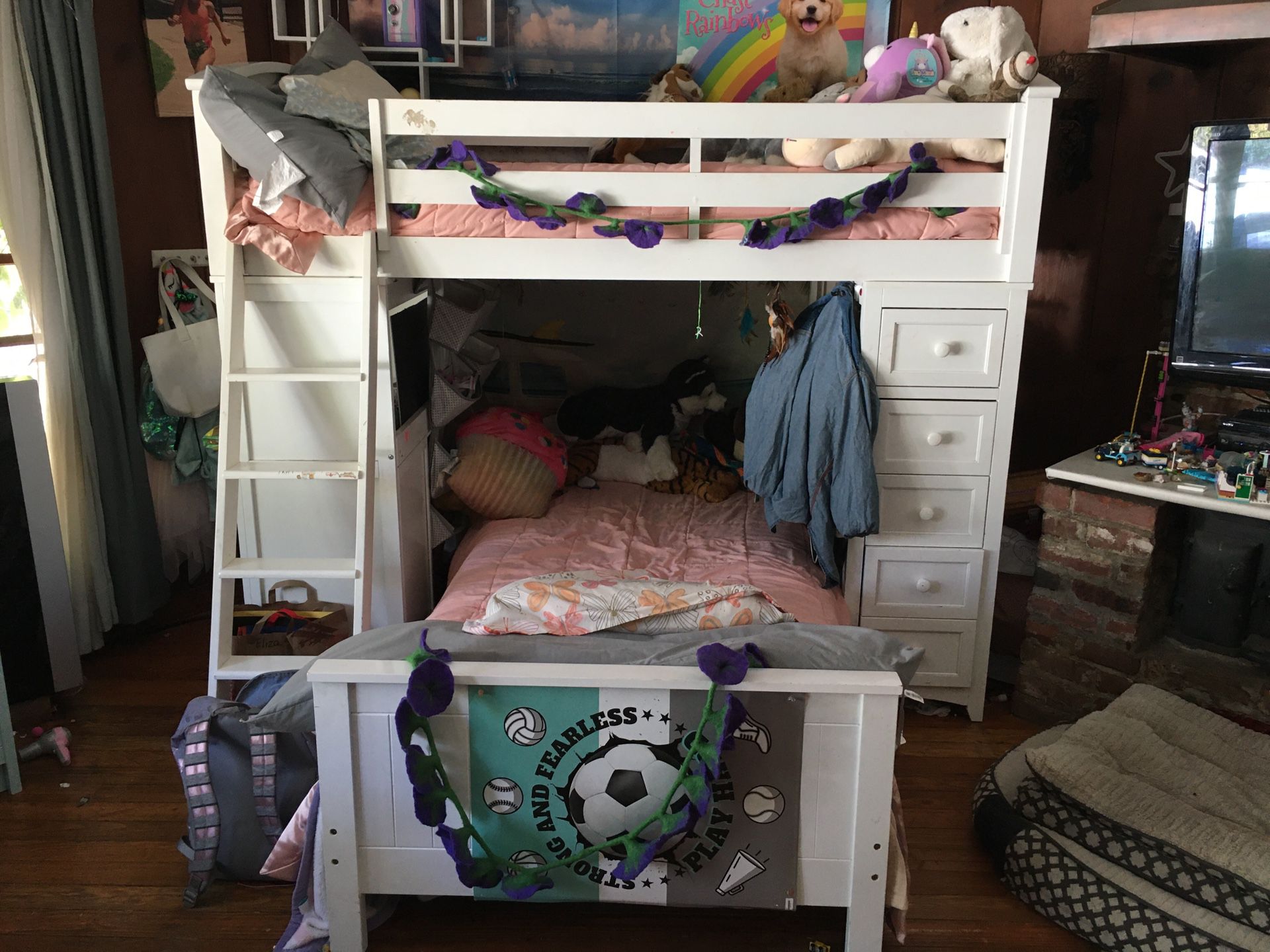 Bunk bed with desk on one side