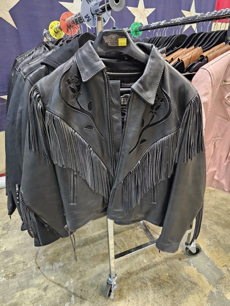 Vintage ladies Leather Jacket with rose detail & fringe. Removable thinsulate liner. Size 10 (medium)

$130 FIRM