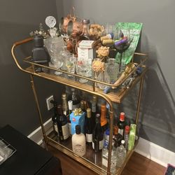 Bar cart with Moscow Mule Mugs and a Bottle of Wine