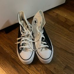 white and black converse shoes