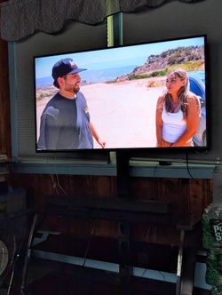 Tv. Sound Bar And Stand.