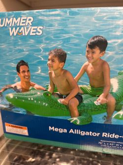 Summer waves giant ride on blowup alligator. This is brand new in box.