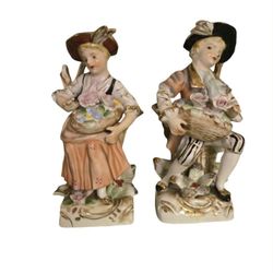 vintage 8" colonial style ceramic   figurines made in Japan both numbered