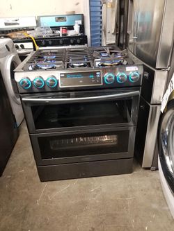 Estufa de gas marca Samsung black stainless doble orno