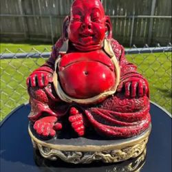 The Red Big Belly Buddha Statue