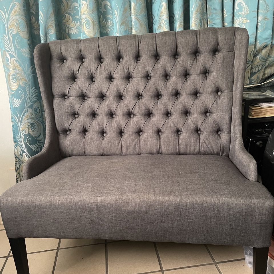 Set Of Living Room Set. Includes a settee, an ottoman, and a chair. Never used. Grey Color and convenience for small spaces 
