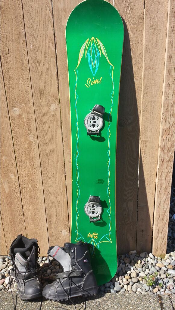 Vintage Sims Daytona 66 snowboard with bindings and boots.