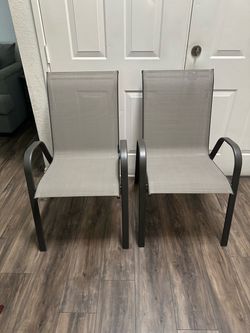 grey sling patio chairs featuring breathable mesh fabric and dark metal frames. [1] (https://offerup.com/redirect/?o=aHR0cHM6Ly93d3cuYXRob21lLmNvbS9zd