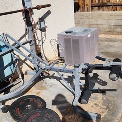 Weight bench with bicep curl, leg extension and leg curl.