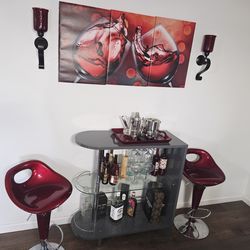 Modern Bar Table with 2 Red Swivel Stools – Excellent Condition
