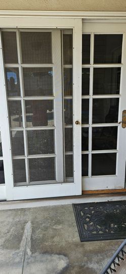 Sliding solid wood French doors with screen