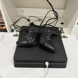 PS4 With 2 Controllers And 8 Games 