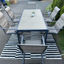 7 Piece Outdoor Dinning Table With 6 Rocking Chairs 