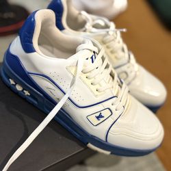 Louis Vuitton Trainer sneakers in white and blue calf leather. 