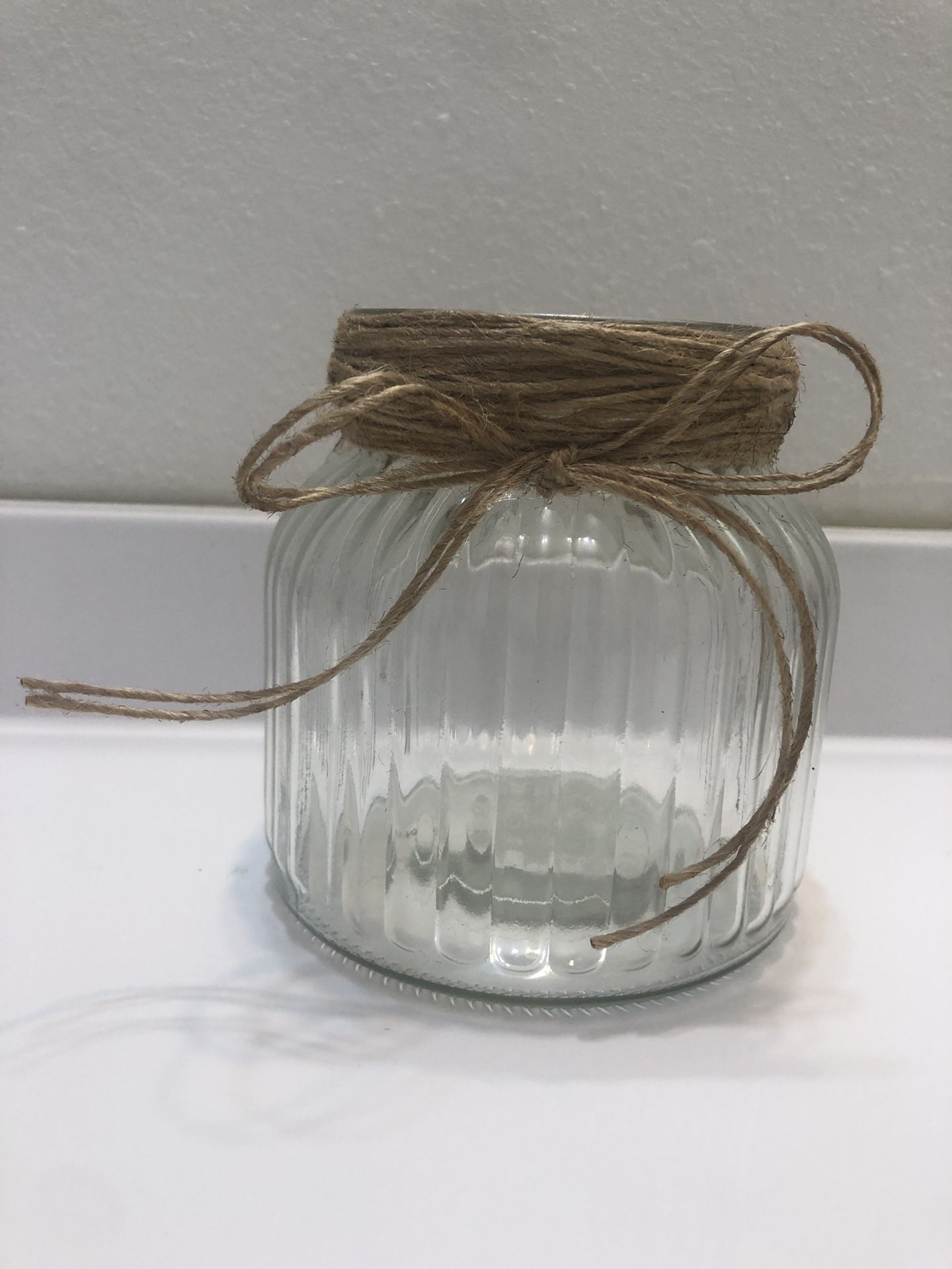 Glass vase with elegant rope tie for home or party decoration