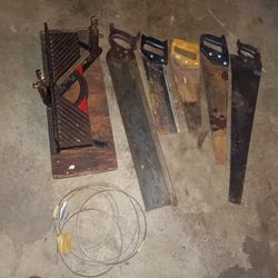 vintage miter box and original 29" saw, other saws, and saw blades, selling as lot