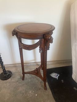 Carved wood ram’s-head round accent table — $80 OBO